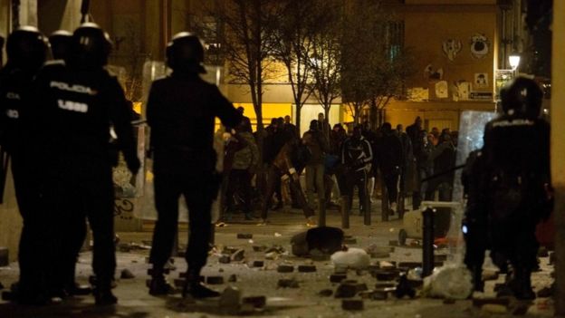 Violence erupts in Madrid over migrant death Violence erupts in Madrid over migrant death